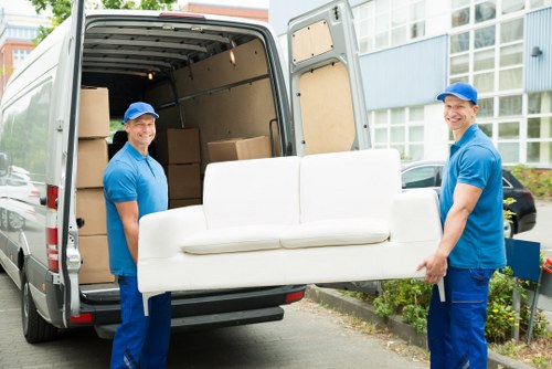 Moving van and packed boxes for a home move in Ealing