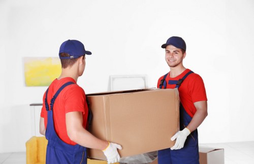 Office relocation team packing equipment in Ealing