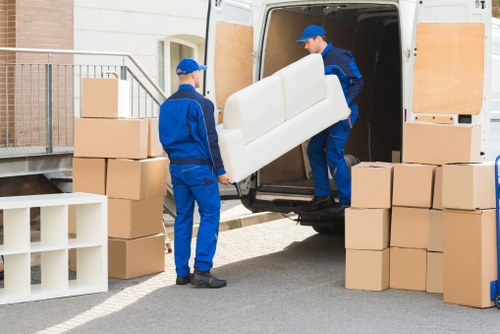 Removal team loading boxes for a move in Ealing