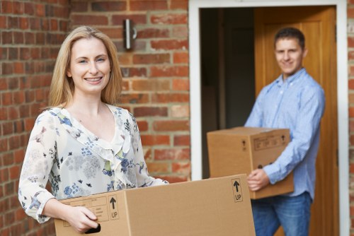 Local moving crew unloading furniture at a property in Ealing