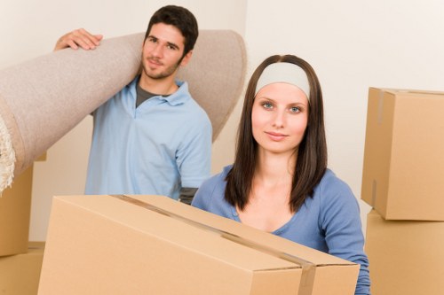 Removal van loading in a busy West London neighbourhood near Ealing