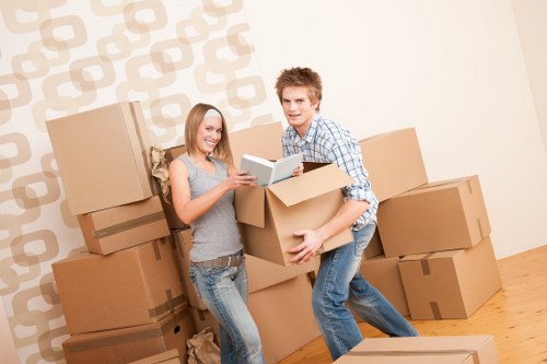 Professional movers handling office furniture and equipment in Ealing