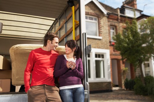 Local moving team loading furniture into a removals van in Ealing