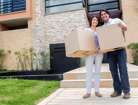 Furniture being carried from a flat in west London