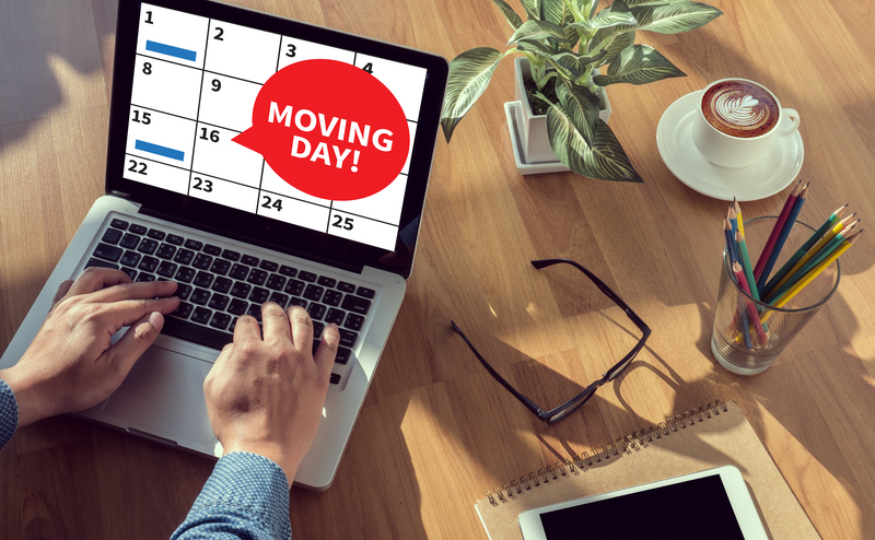 Professional movers handling packed household items in Ealing